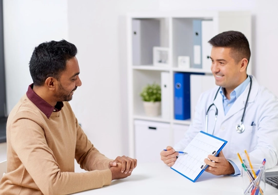 Doctor And Patient Having A Friendly Consultation