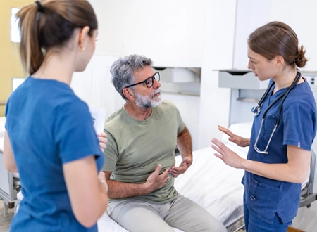 Doctor Discussing Patient Treatment Hospital